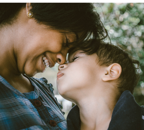 A parent and child sharing a warm moment together